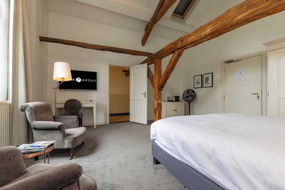 Stretch out with seating, desk space, and evening entertainment nearby.