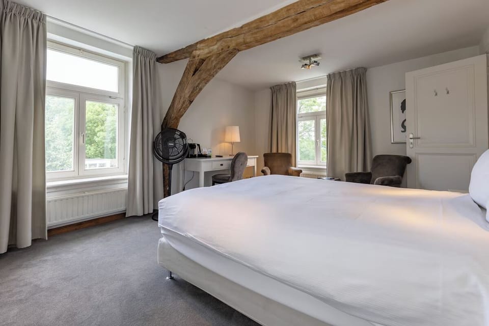 Wake to soft daylight and serene views from your bed.