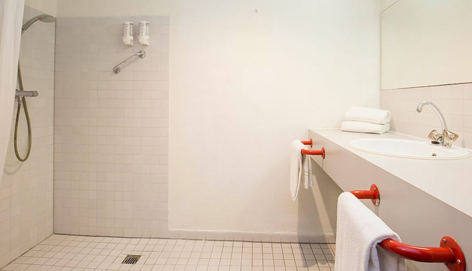 Refresh easily in a clean, walk-in shower space.