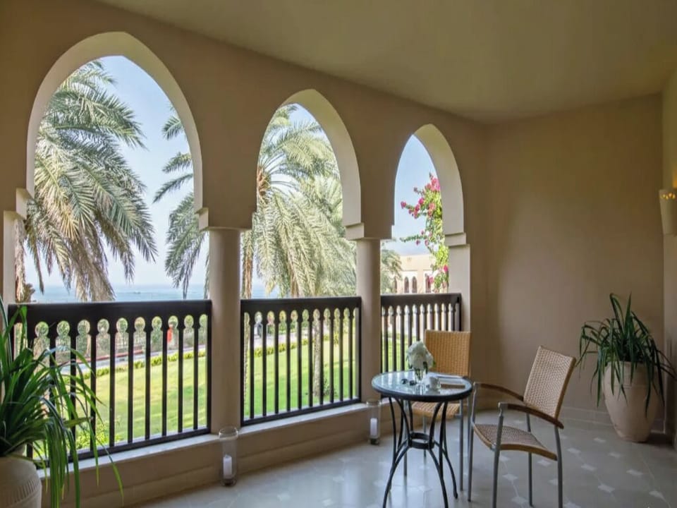 Sip morning coffee on the balcony among palms and views.