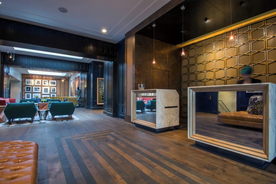 Sip at the sleek bar under warm pendant lighting and glow.