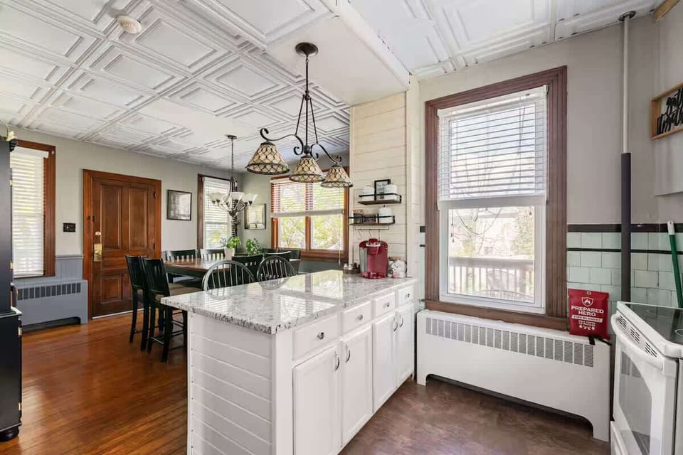 Kitchen and Dining Area Overlooking Backyard and Fire Pit