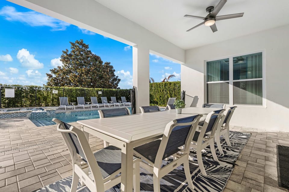Shaded dining space ideal for family meals in the Florida breeze.