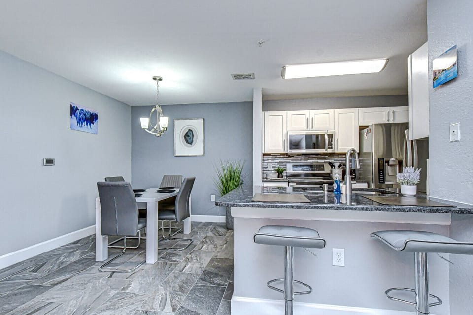 The kitchen offers plenty of seating options for dining.