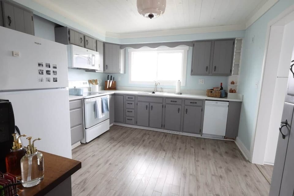 Full kitchen with all the essentials, new countertops, and a new sink. A recently added small dishwa