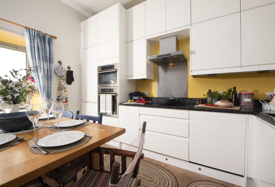 12 Merchants Quarter, Charlestown. First Floor: Kitchen with an electric oven, induction hob, microwave, combi oven, fridge, freezer and dishwasher