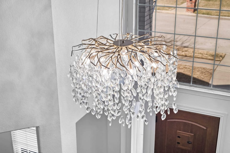 Elegant crystal chandelier adding a stylish and sophisticated touch to the space.