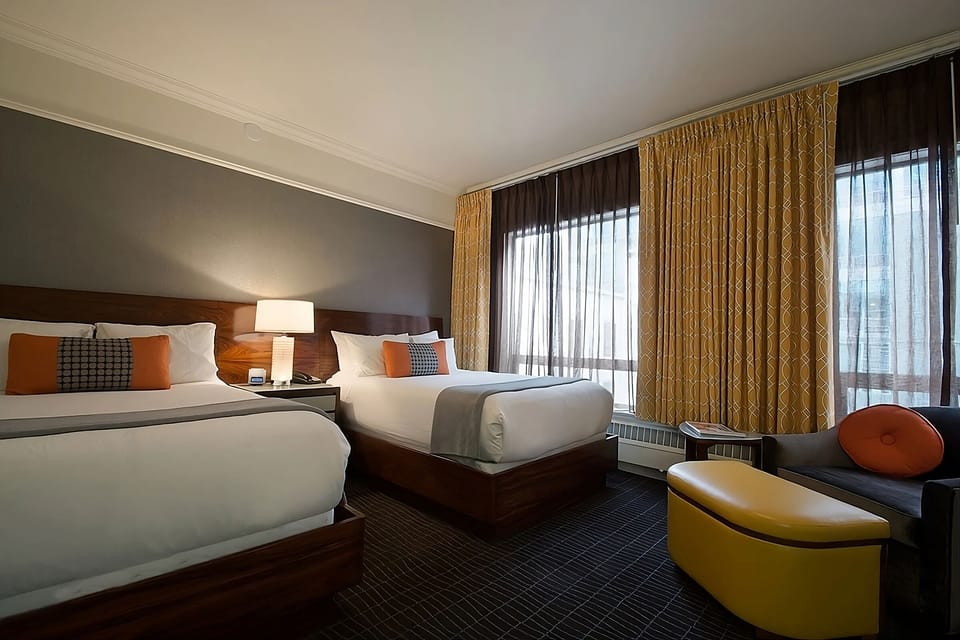 Relax together in a sunlit room with inviting seating.
