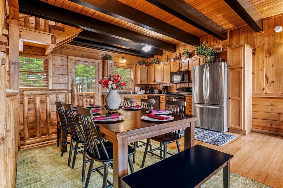 Seat the whole crew for family dinner or game night — this farmhouse table is the heart of the cabin.