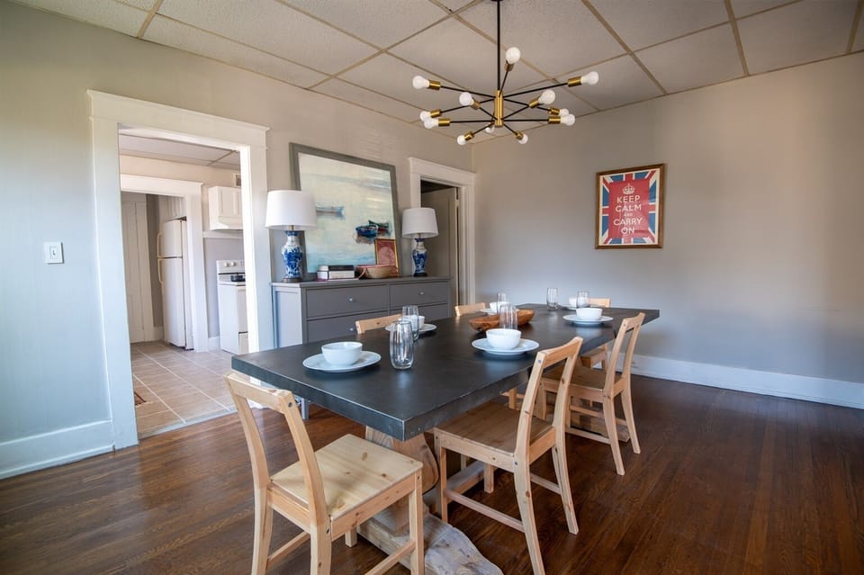 Contemporary dining area perfect for gatherings, with stylish seating and kitchen access.

