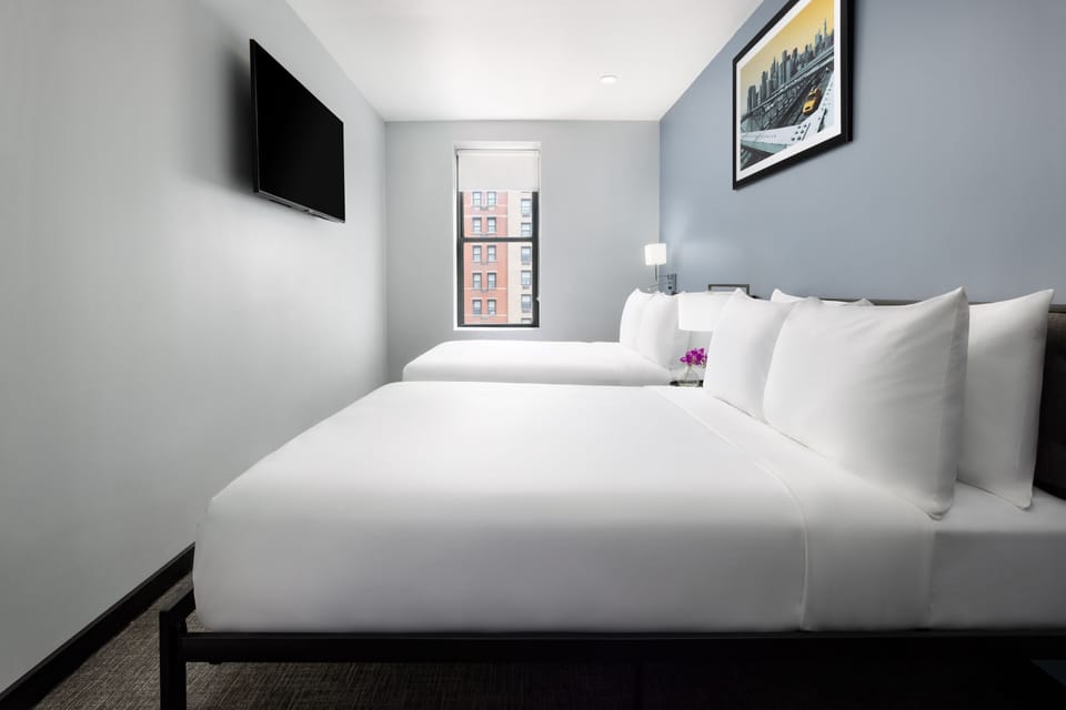 Unwind in crisp linens after a vibrant city day.