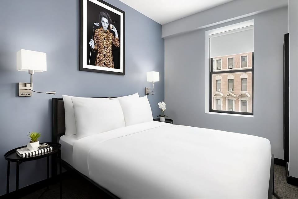 Lounge peacefully in a stylish room with bright window views.
