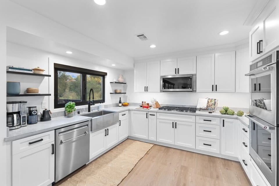 Delight in this beautifully designed kitchen featuring modern appliances, ample counter space, and a view that makes cooking a pleasure.
