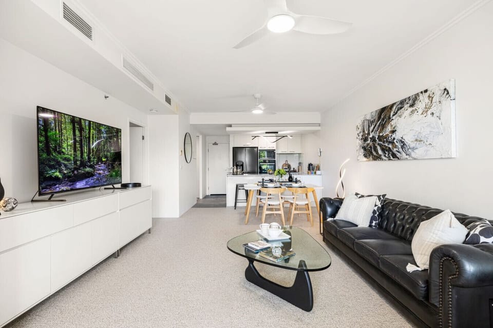 Open plan living area with dining area and breakfast bar