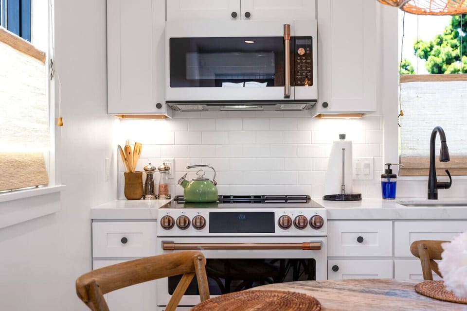 Light-filled kitchen with sleek cabinetry, updated appliances, and thoughtful details.