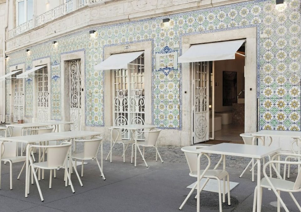 Step outside to charming tiled façade and terrace seating.