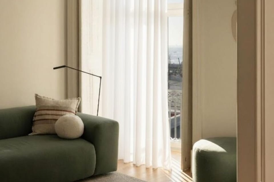 Breathe in fresh air by the balcony doors and light.