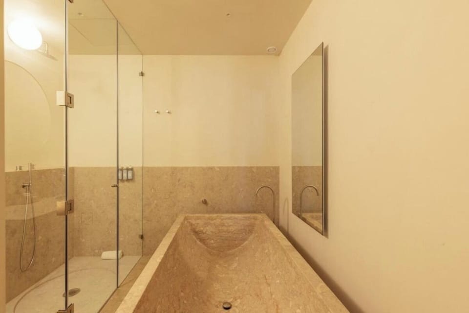 Soak deeply in the stone tub after beachy days.