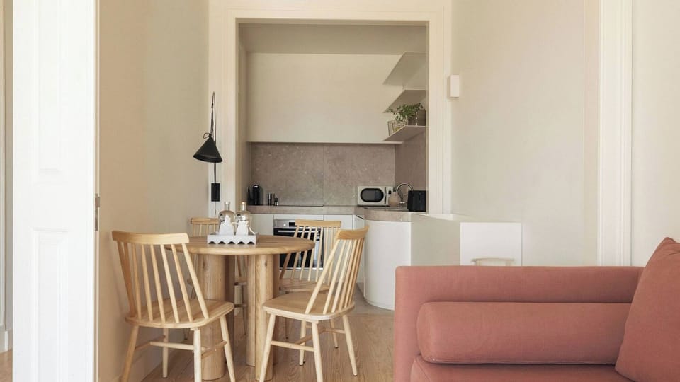 Sip coffee on the sofa with the kitchen close by.