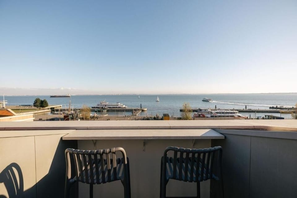 Sip morning coffee on the balcony overlooking the harbor.