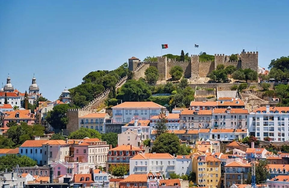Take in hilltop castle views above colorful city rooftops.