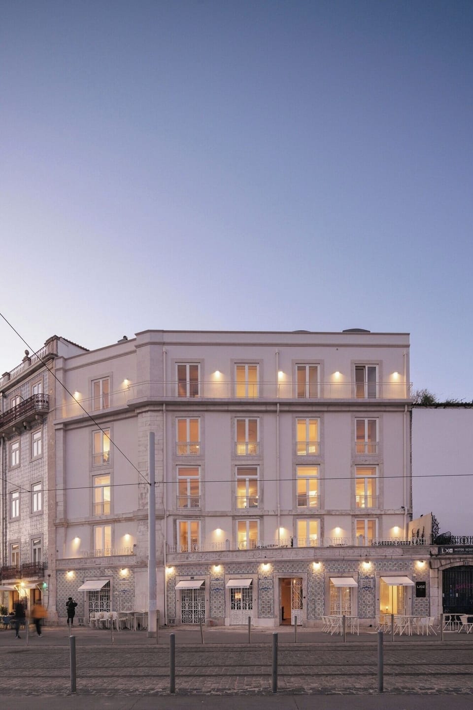 Admire the bright corner building with welcoming street presence.