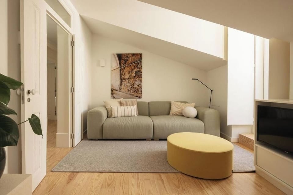 Unwind on the plush sofa beneath warm, calming light.