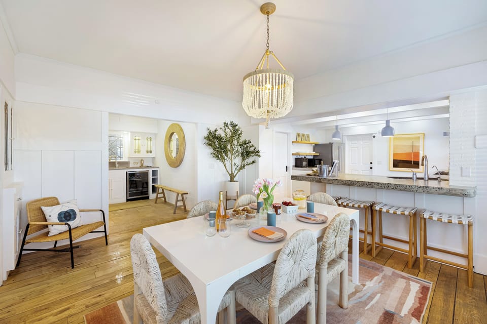 Airy dining room with breakfast bar—perfect for group meals.