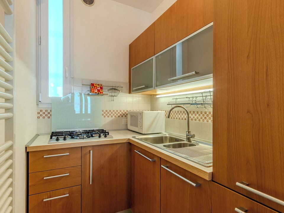 Kitchen, Kitchen Appliance, Countertop, Major Appliance, Wood, Cabinetry, Kitchen Sink, Flooring, Interior Design, Kitchen Stove