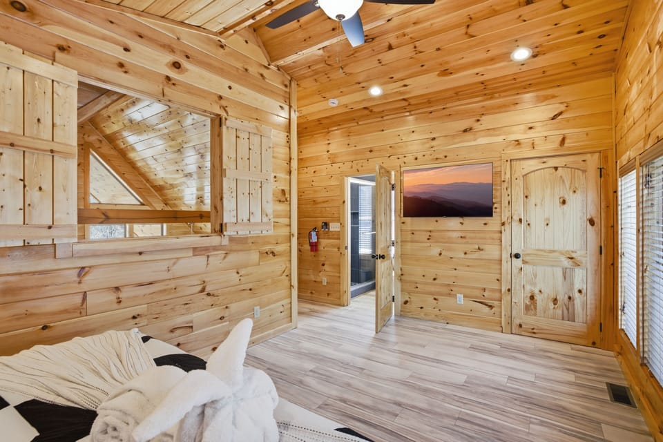Cabin in the Smoky Mountains "Let The Good Times Roll" - Upper level bedroom with 50 inch TV