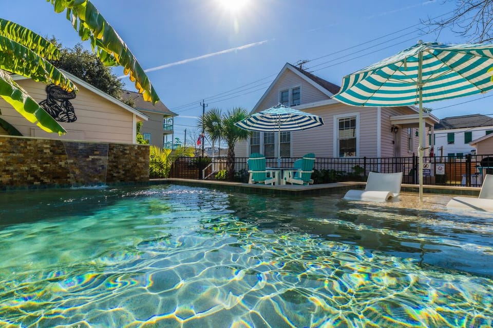 Relax and unwind at this charming coastal home featuring a private pool and outdoor lounge space
