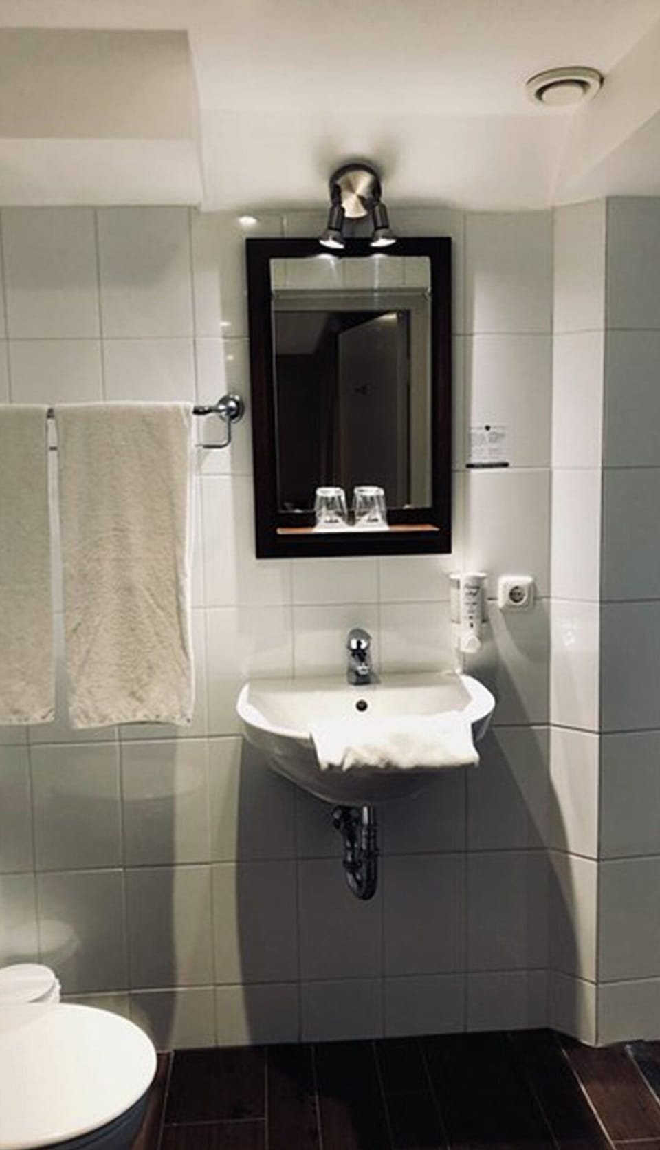 Start your morning at a bright vanity with fresh towels.