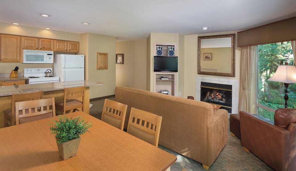 Two-Bedroom-Dining-Living-Whispering-Woods-Resorts