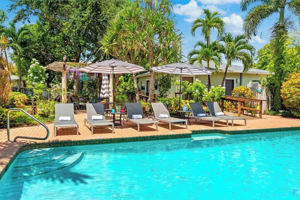 Heated resort style pool with plenty of pool side seating.