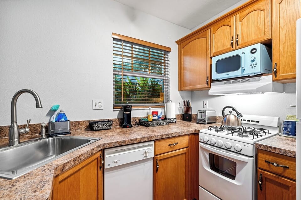 This full chef's kitchen is perfect for making your at-home meals.  Among the amenties included are dishwasher, gas stove, refridgerator, microwave, blender, toaster, coffee station, cookware and more.