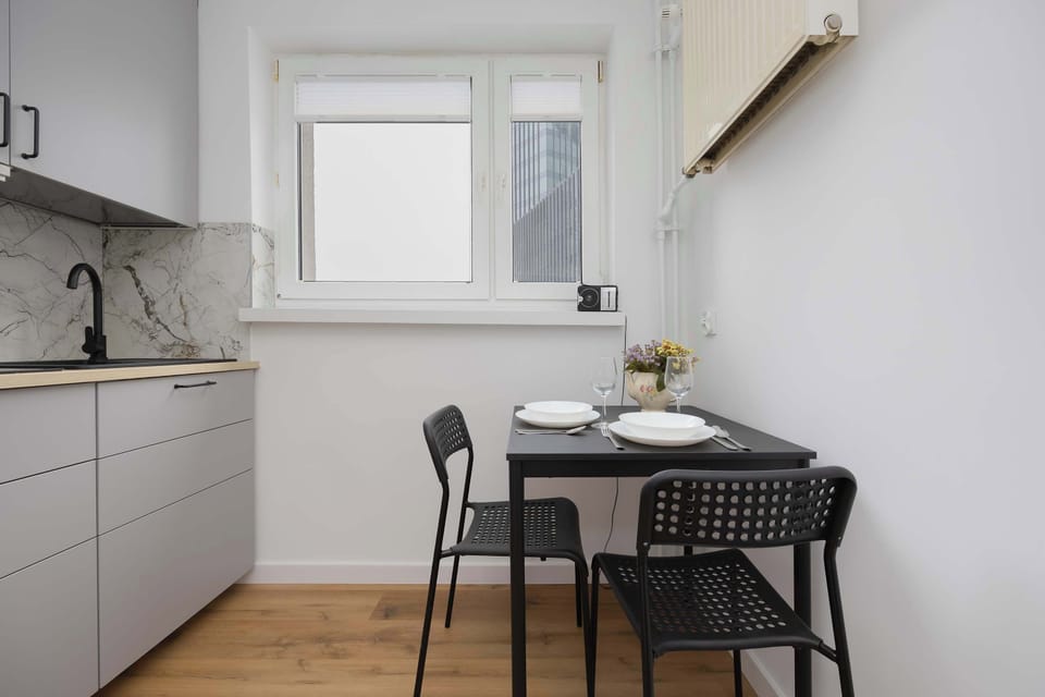 Compact dining table placed next to the kitchenette, perfect for casual meals.