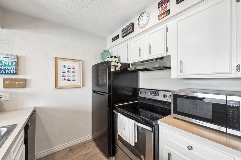 Your fully equipped kitchen features modern appliances and ample storage, perfect for preparing meals during your stay.