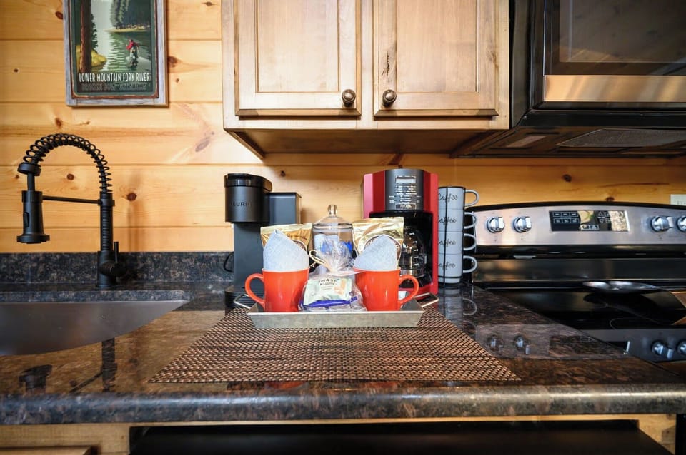 Your morning coffee awaits in this thoughtfully equipped kitchen, complete with premium appliances and charming rustic touches for memorable vacation mornings.