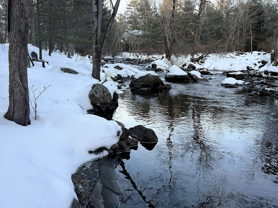 “Morning coffee and evening wine beside your private Pocono stream”