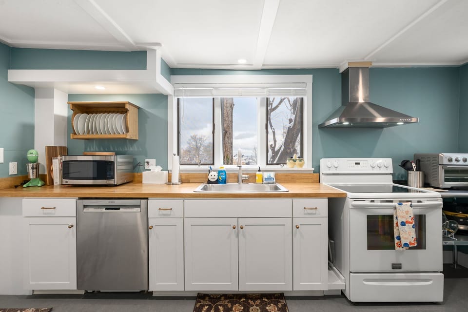 Fully-equipped kitchen with modern appliances.