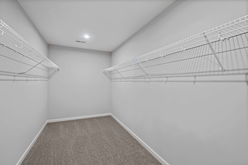 Keep clothes & bags neatly tucked away in the primary king suite’s closet​