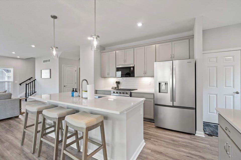 The chic, open kitchen offers ample space & all the comforts of home​