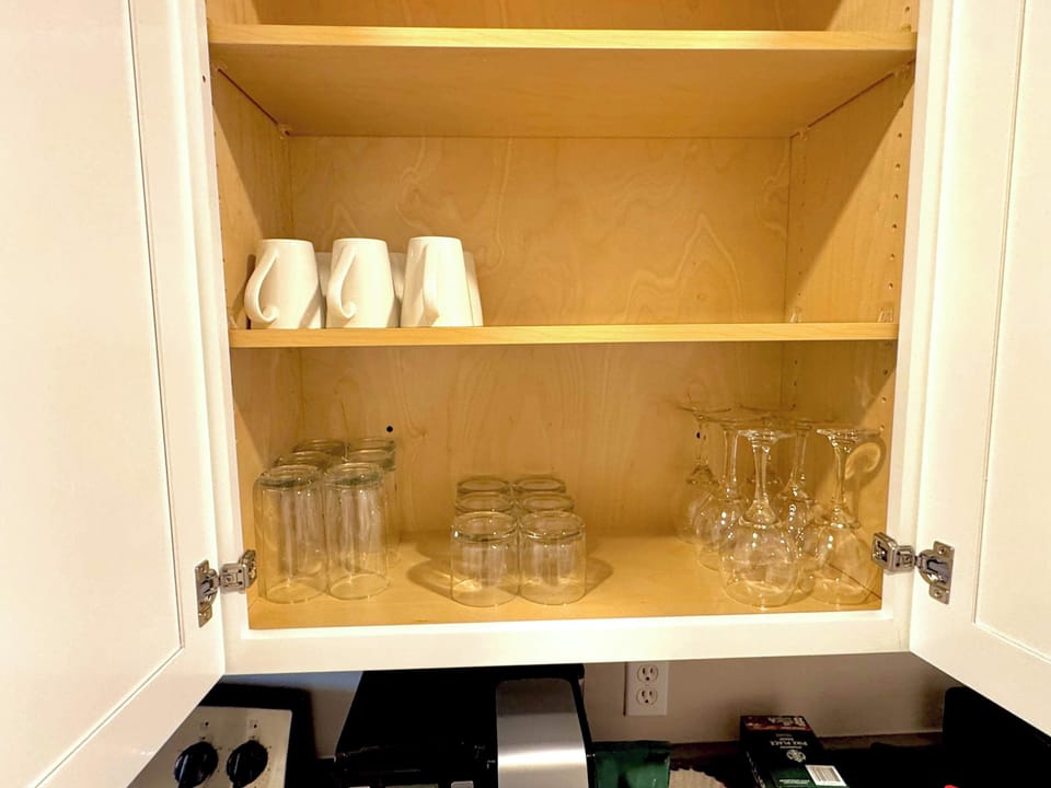 Fully stocked drinkware (6 mugs, 6 tall glasses, 6 short glasses, 6 stemmed wine glasses). 
