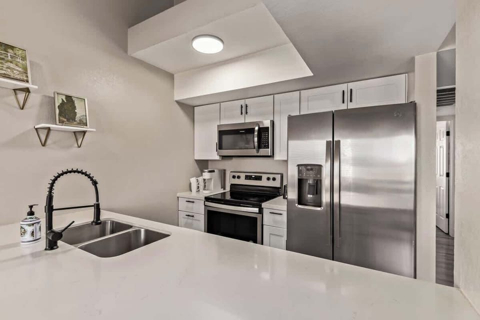 Fully stocked kitchen with modern appliances, cookware, and all essentials to prepare your favorite meals.
