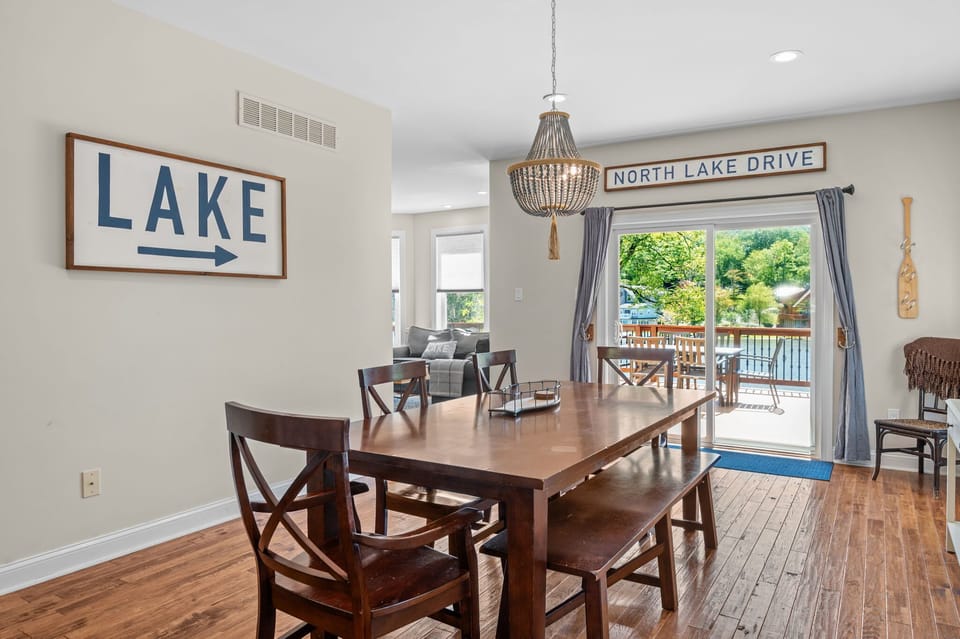 Gather for family dinners at the dining table with lake views through the sliding door