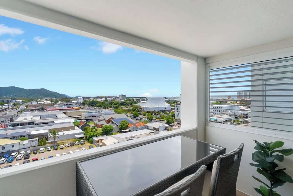 The studio balcony provides a private alfresco retreat with elevated views across Cairns.