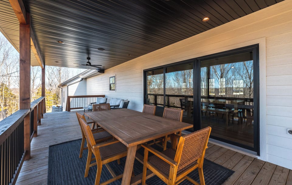 Outdoor dining with TV off the kitchen.