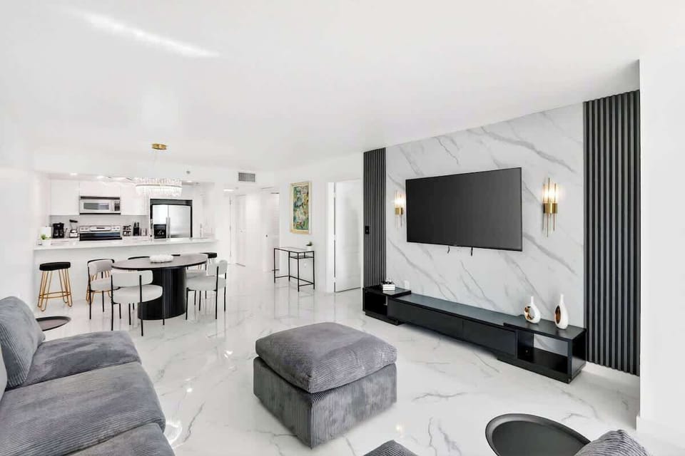 Bright and modern living room with comfortable seating and Smart TV.
