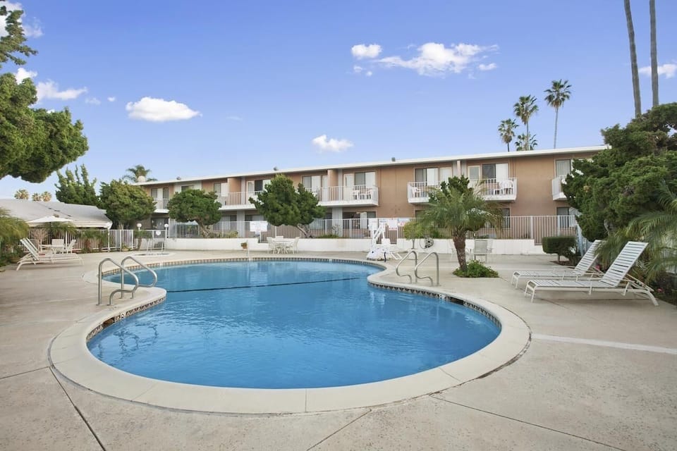 Unwind poolside under sunny skies with plenty of loungers.