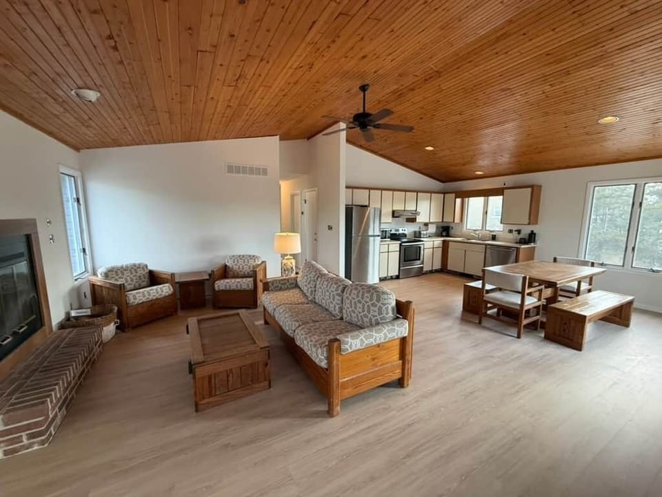 109 - The Great Room combining the kitchen & living room. A 70" being installed above the fireplace.